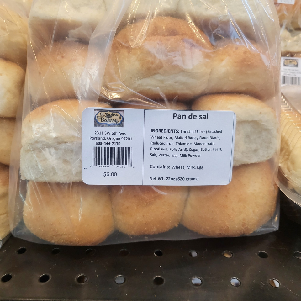 A bag of Pan de sal, Filipino bread rolls, with a label showing ingredients and price.